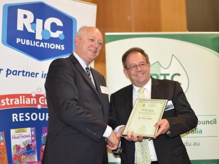Chris Callus our AARE President for WA receives a plaque from the Commissioner for Children and young people Mr Colin Pettit